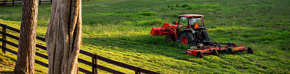 Kubota tractor tilling a lawn