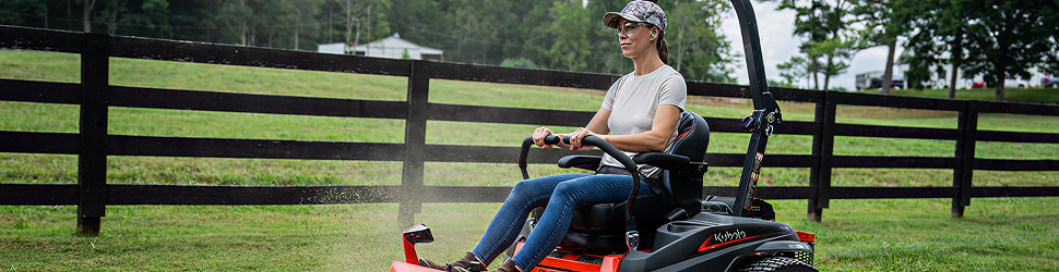 Women riding a Kubota zero-turn mower